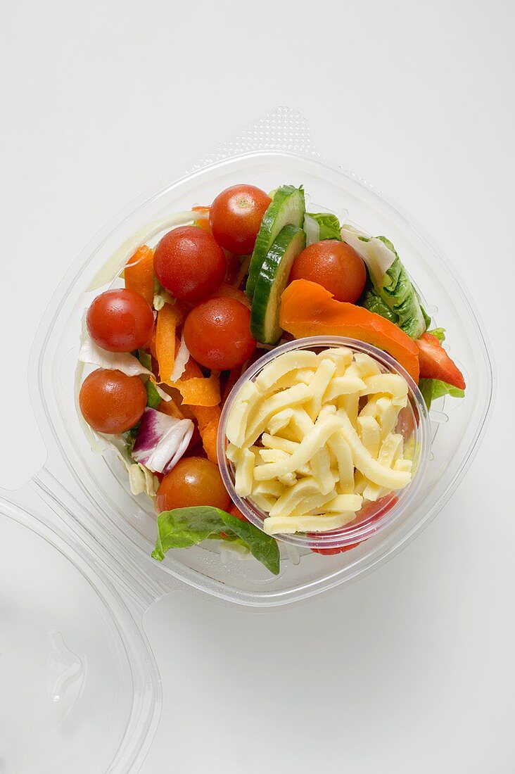 Salad with grated cheese to take away (overhead view)