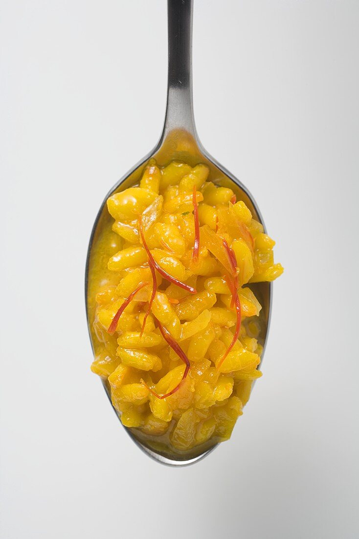 A spoonful of saffron risotto (overhead view)