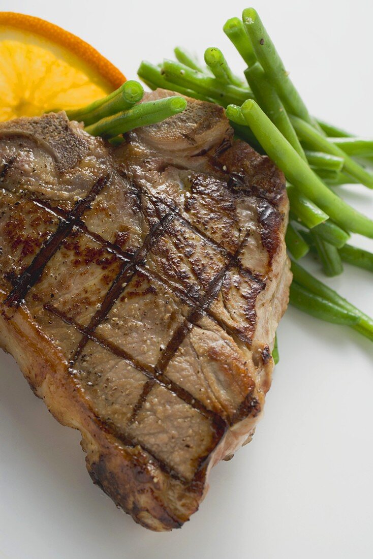 Grilled T-bone steak with French beans