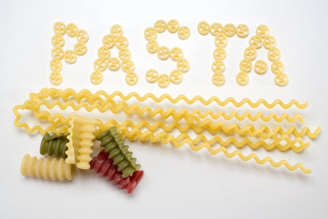 Wagon wheel pasta (the word 'Pasta), fusilli lunghi, riccioli