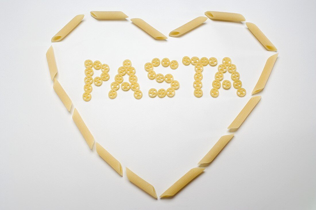 The word 'Pasta' (wagon wheel pasta) in a heart (penne)