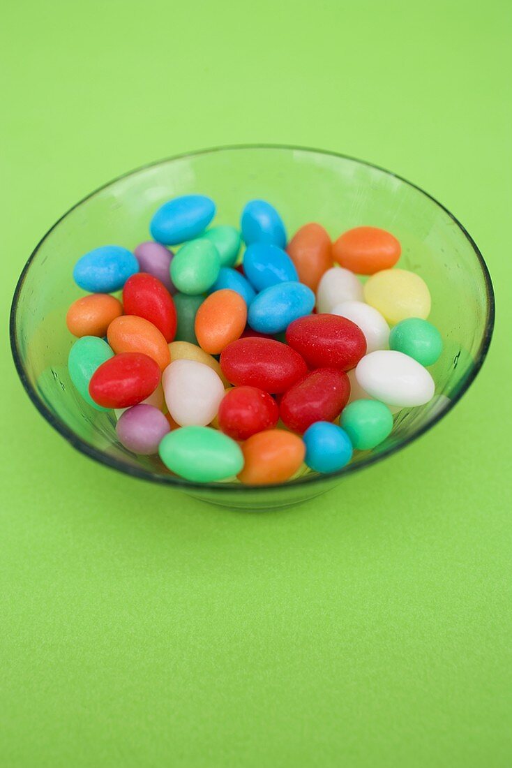 Coloured sugar eggs in glass dish