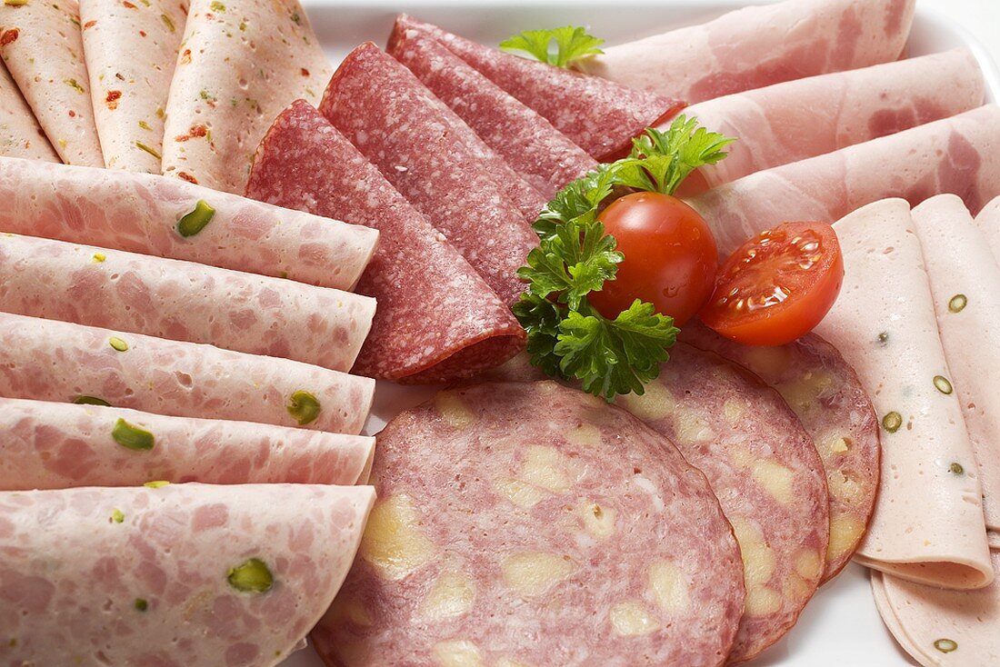Cold cuts platter with cherry tomatoes and parsley