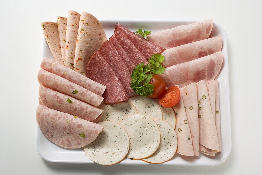 Cold cuts platter with cherry tomatoes and parsley