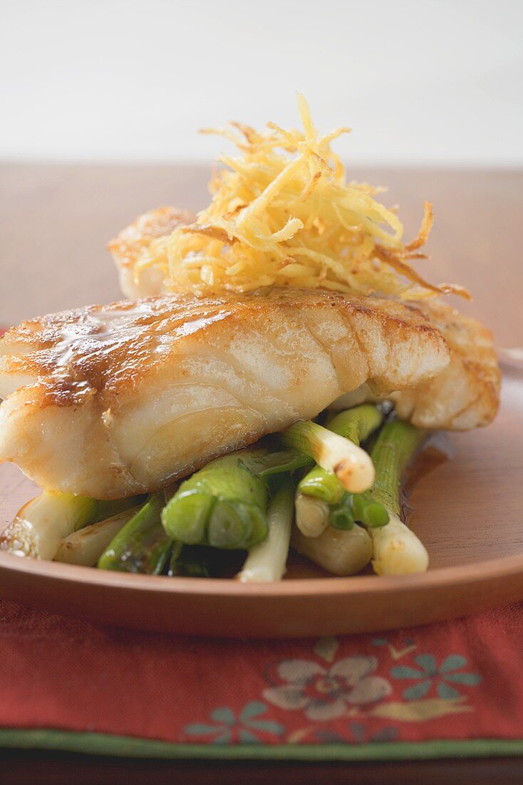 Fish fillet with spring onions