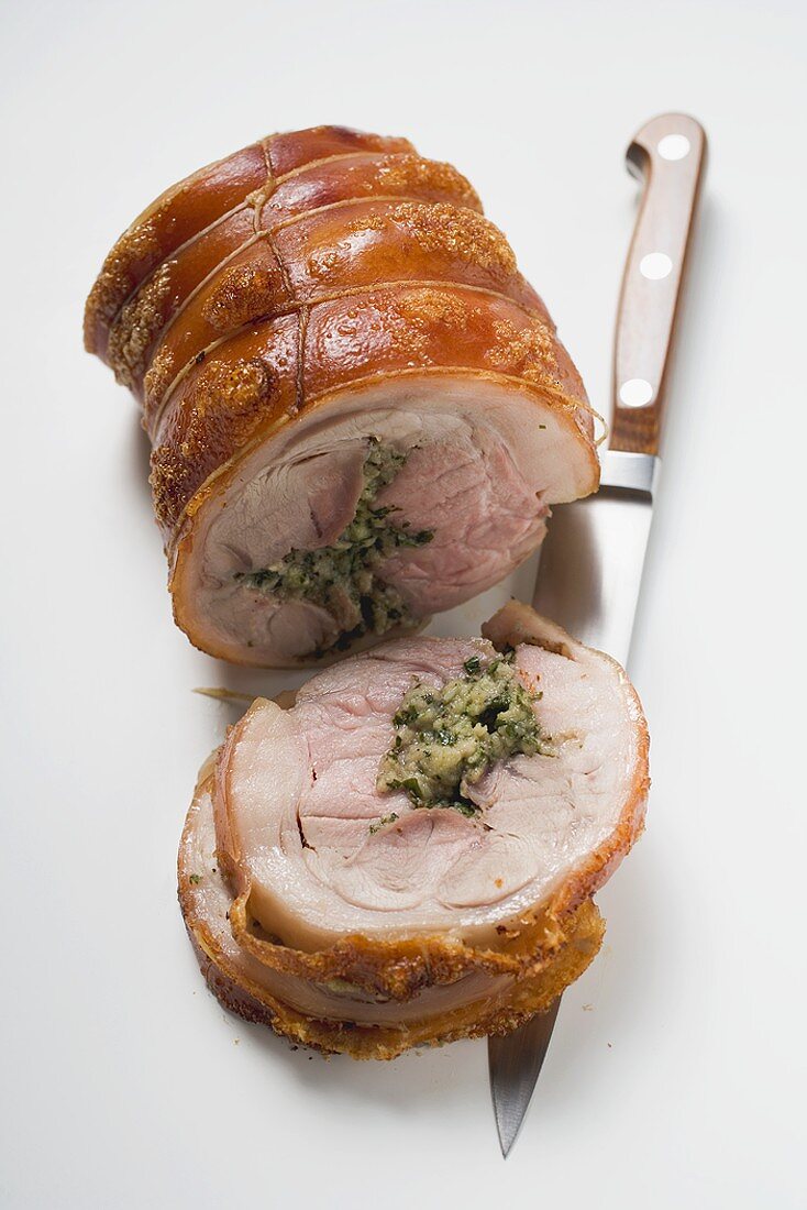 Rolled pork roast with crackling and herb stuffing