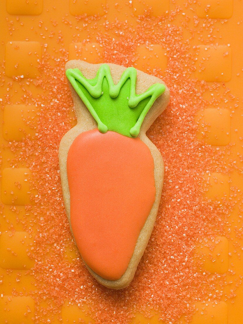 Easter biscuit (carrot) on orange background
