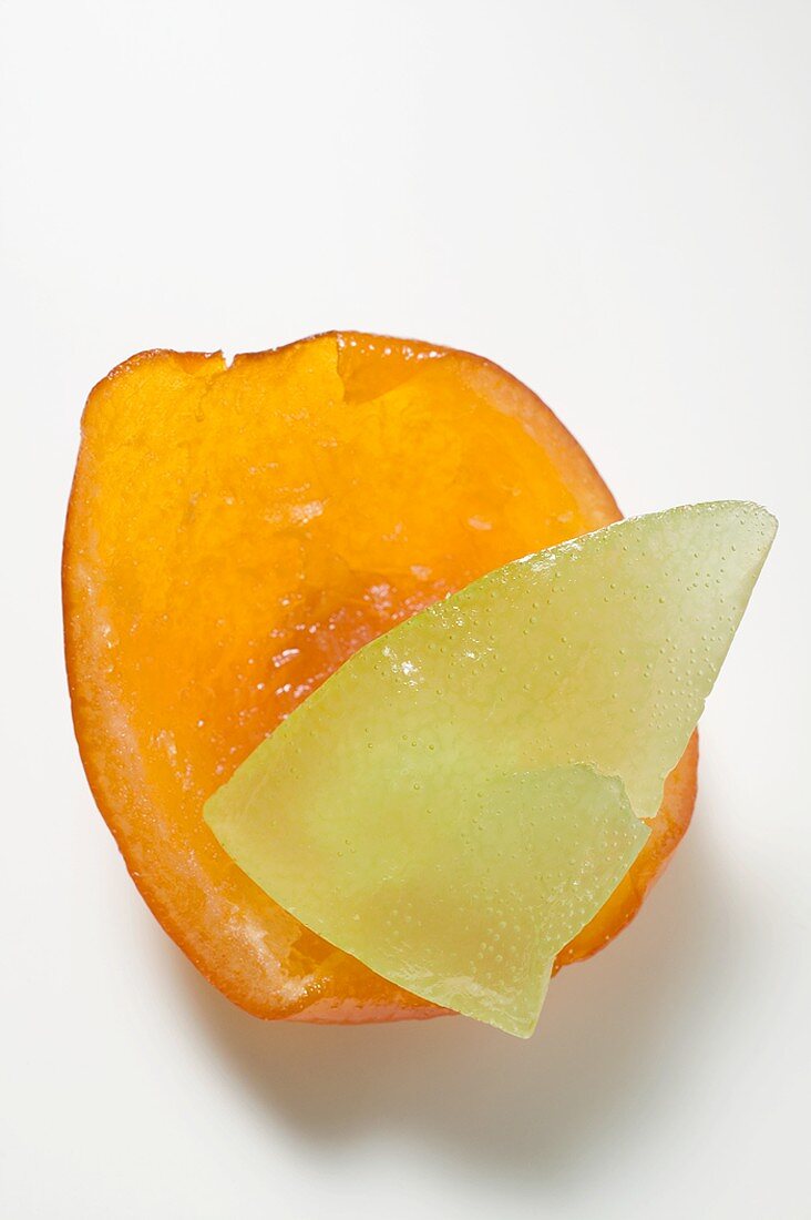 Two pieces of different candied fruits
