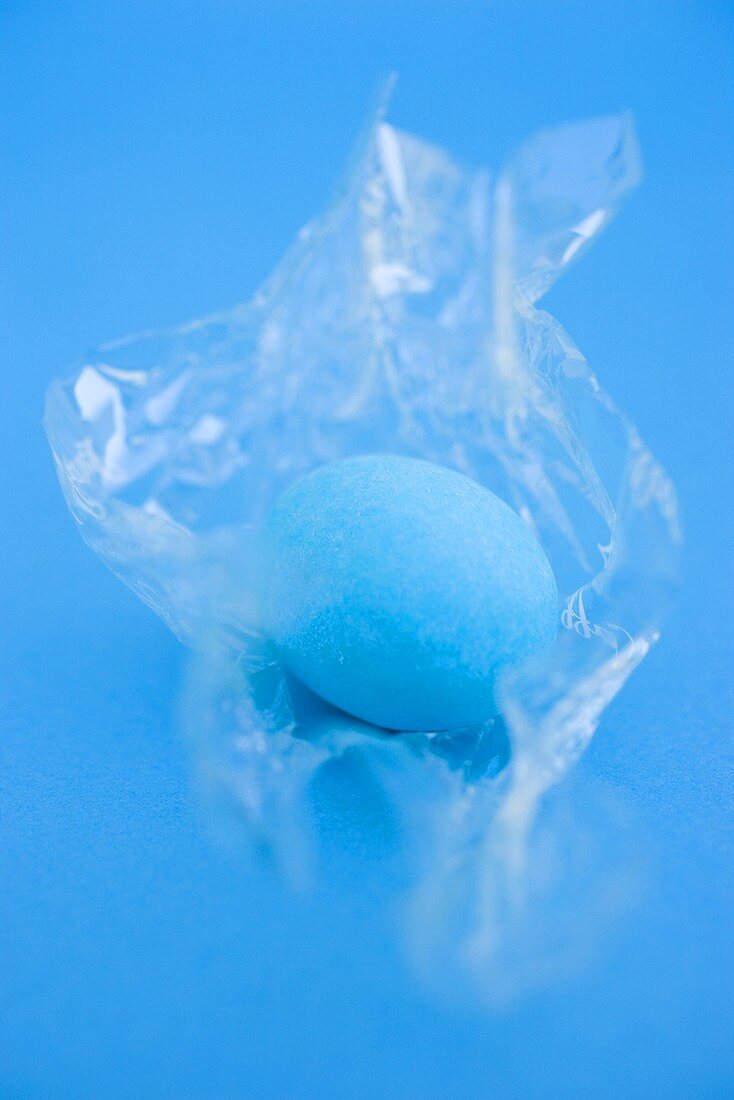 Blue Easter egg in cellophane