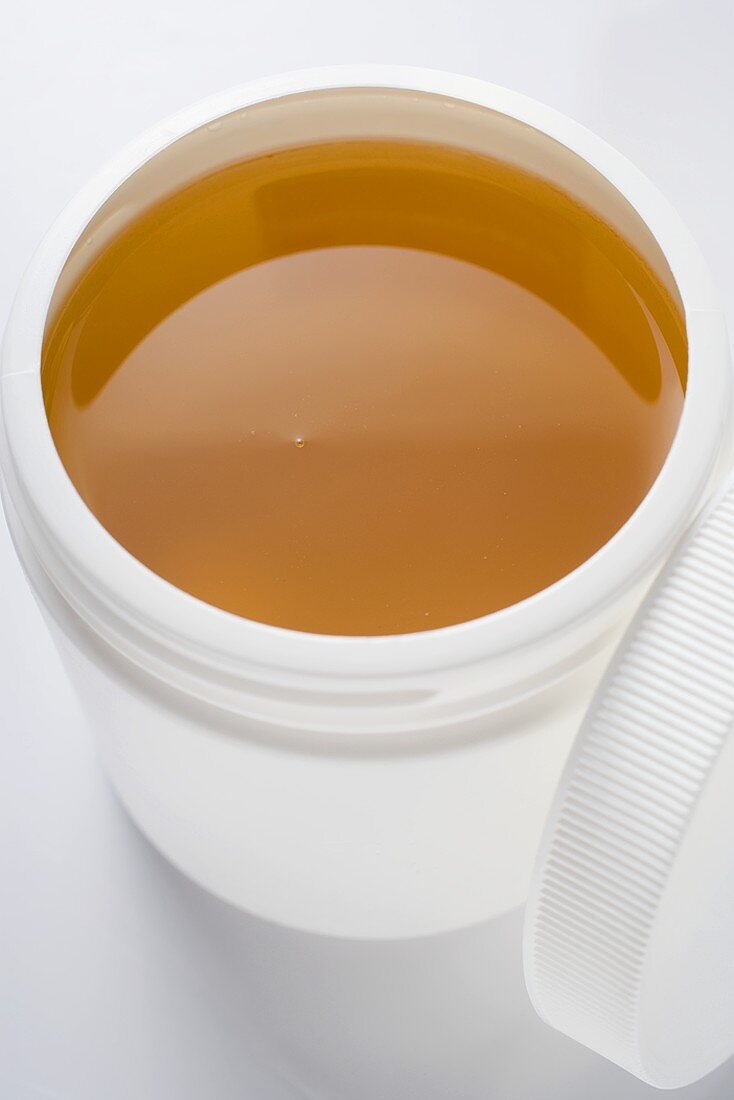 Honey in plastic container