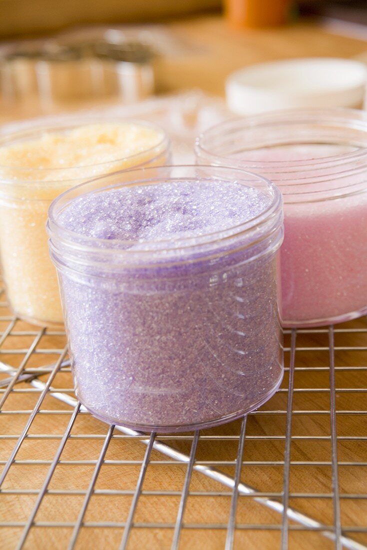 Coloured sugar for decorating biscuits on cake rack