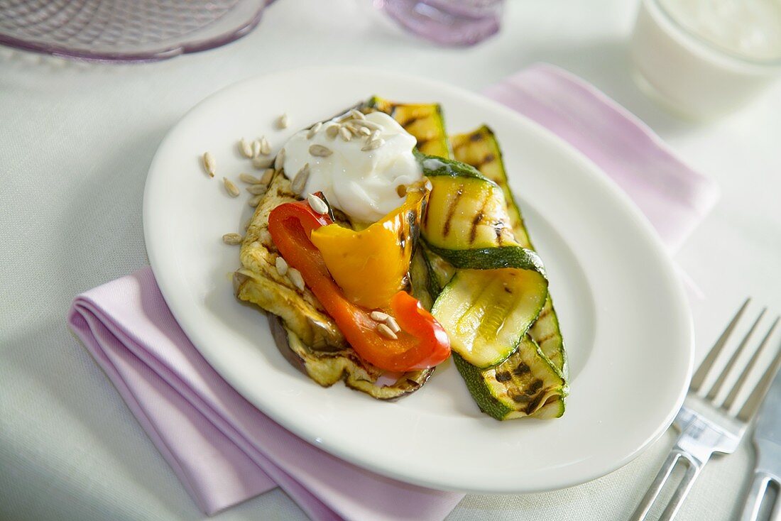Grilled vegetables with crème fraîche and sunflower seeds