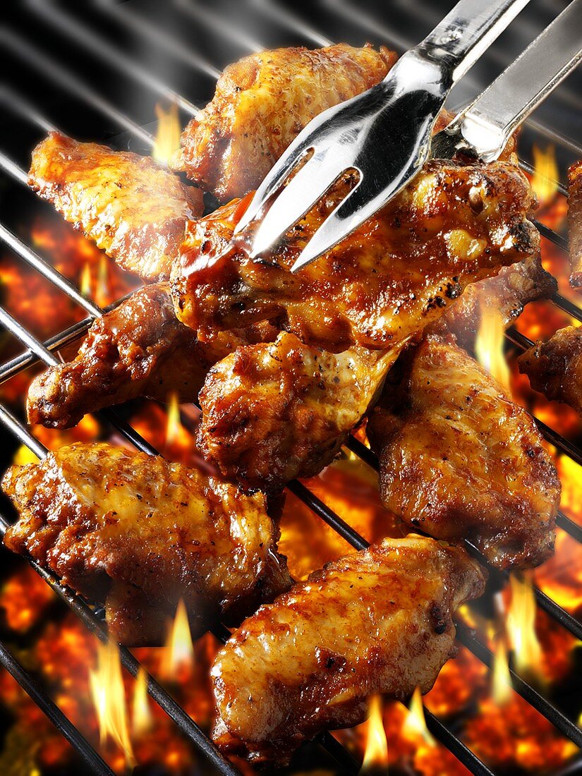 Chicken wings on barbecue rack