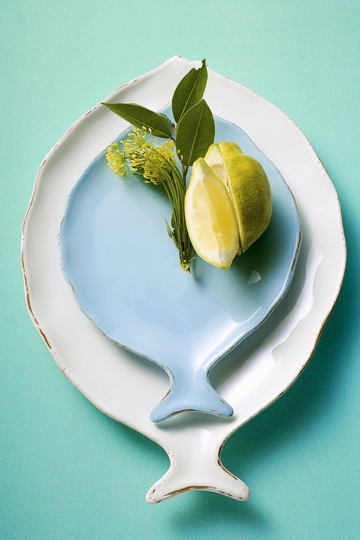White and blue fish plates, decorated with lemon