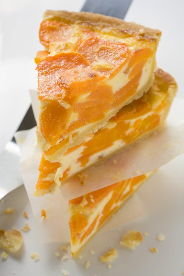 Three pieces of apricot cheesecake