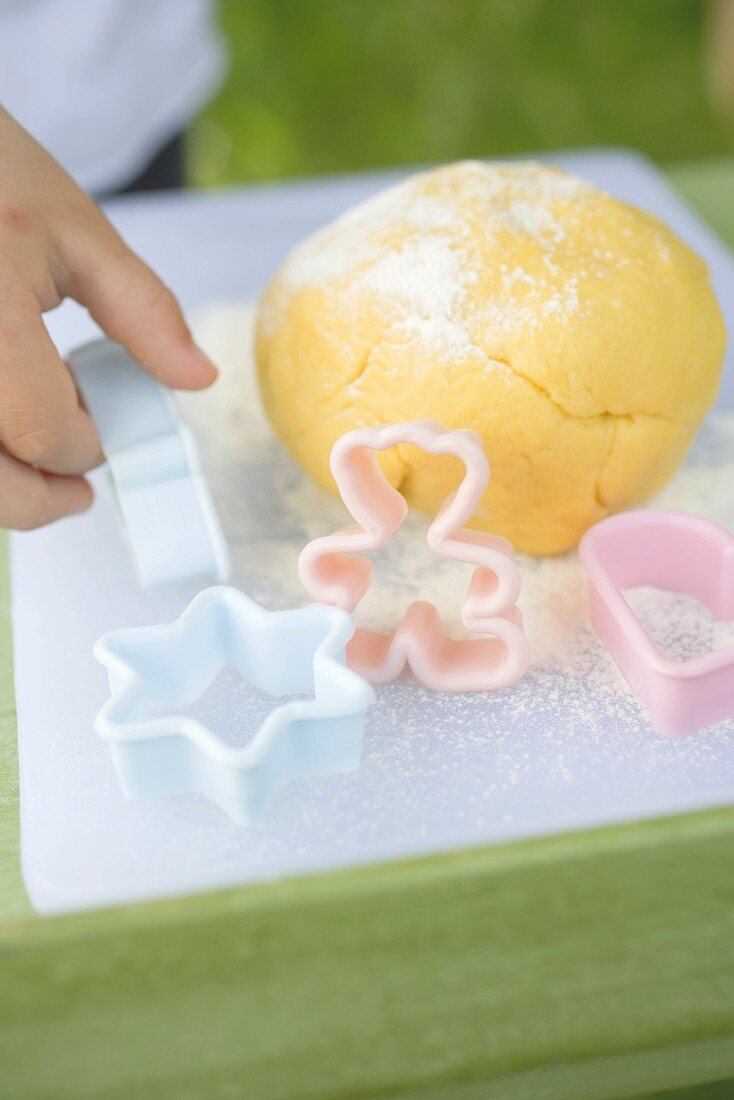 Ball of dough and biscuit cutters