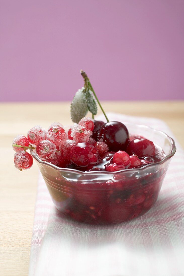 Red berry compote in glass dish