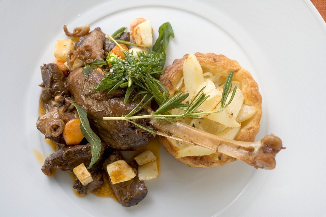 Braised goose leg with pear and onion tart