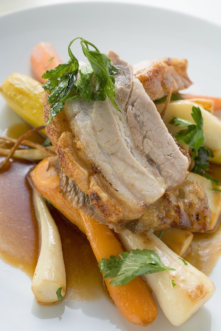 Roast belly pork with crackling and root vegetables