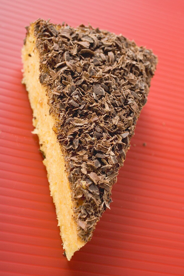 Piece of almond ricotta cake with dark chocolate