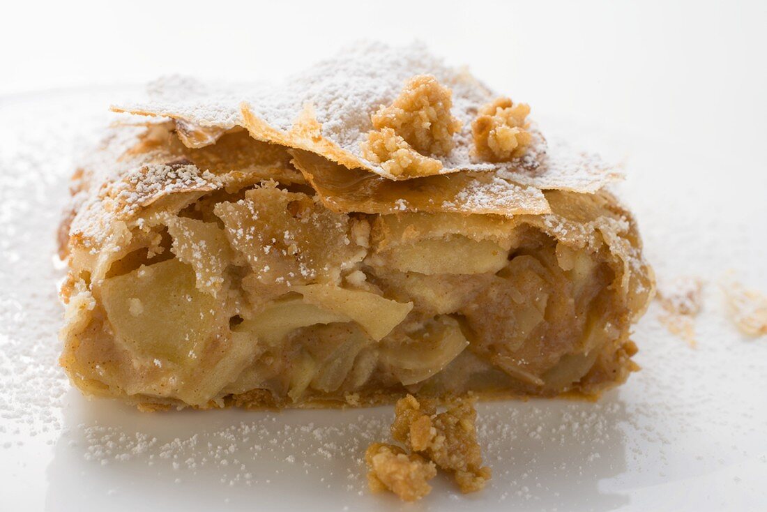 Piece of apple strudel with icing sugar