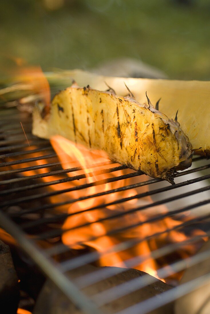 Pineapple on barbecue grill rack