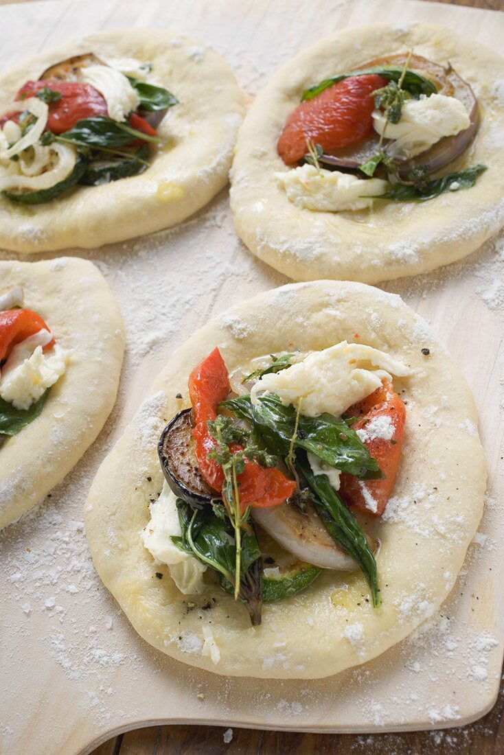 Focaccia topped with vegetables and basil