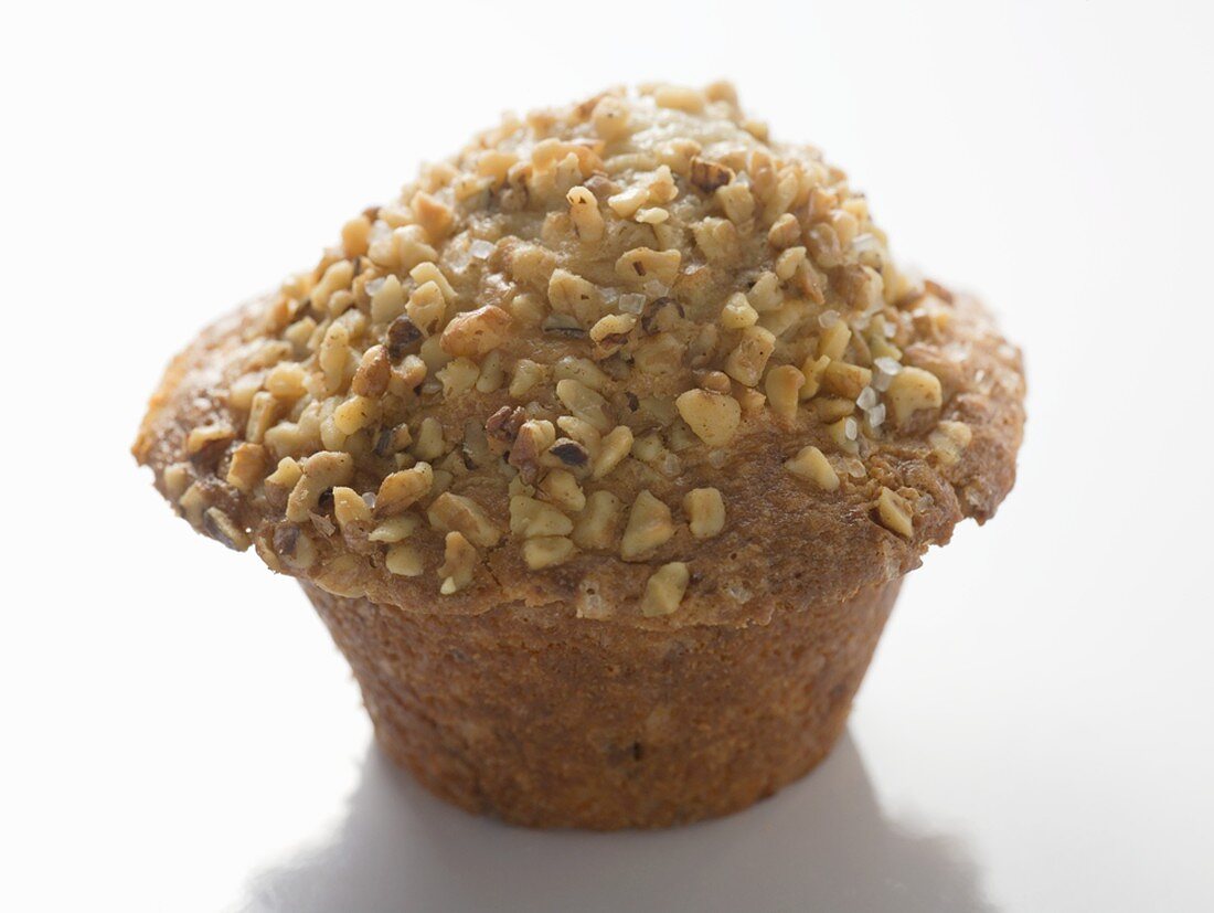 Muffin topped with chopped nuts