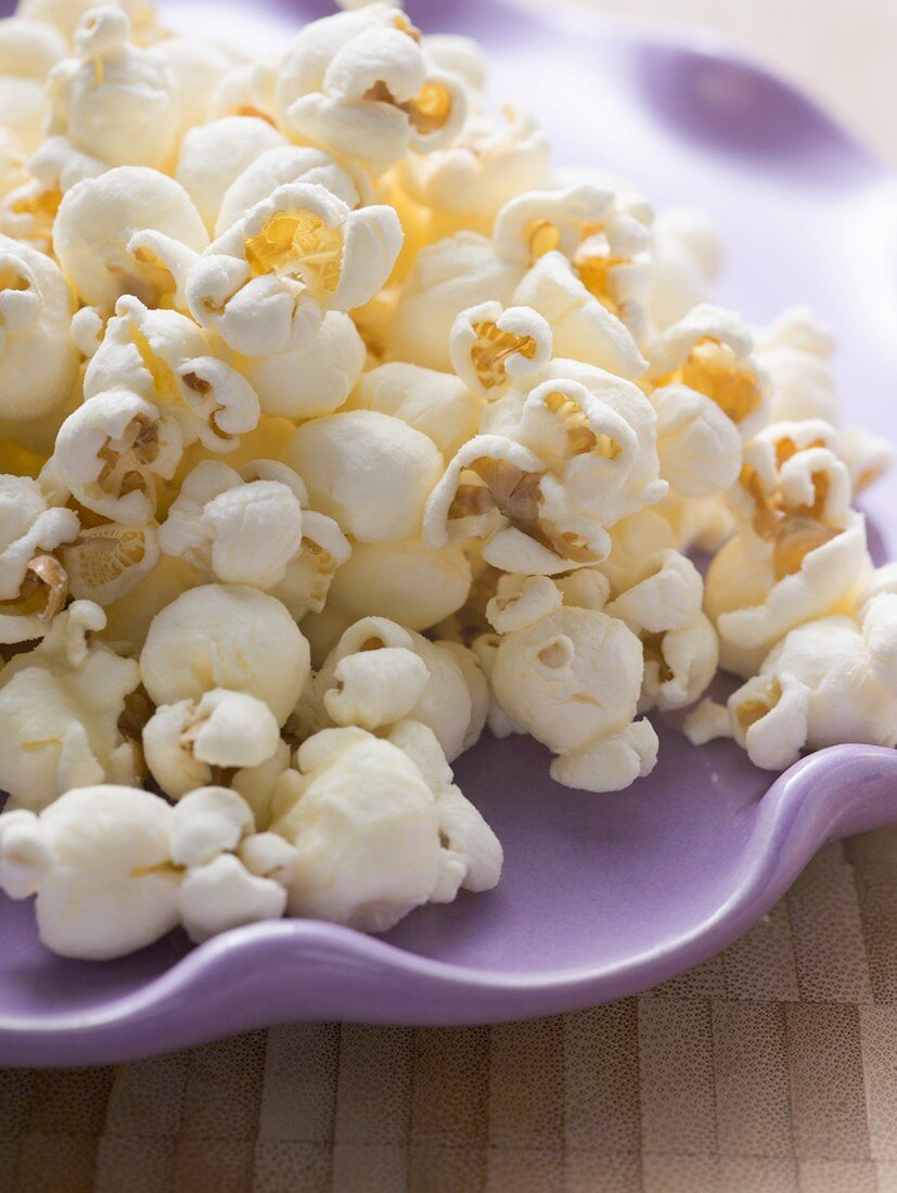 Popcorn on purple plate