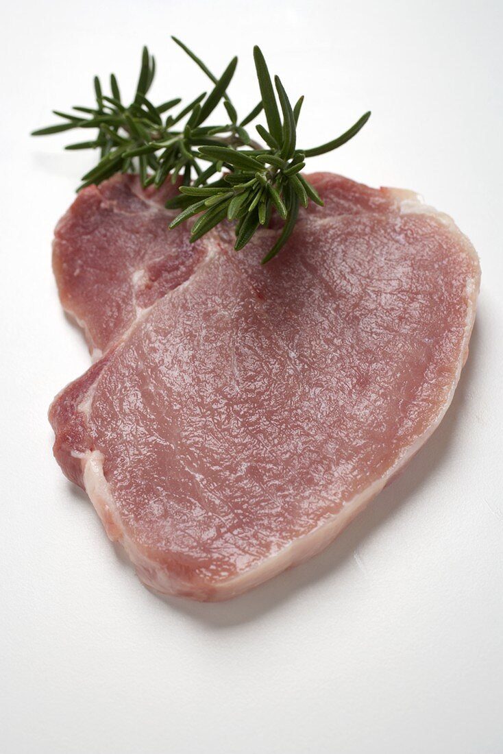 A pork chop with rosemary