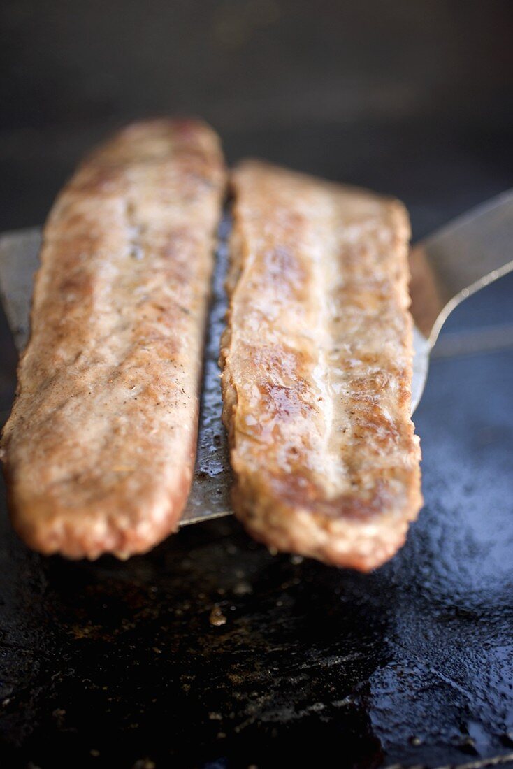 Fried pork sausagemeat on spatula
