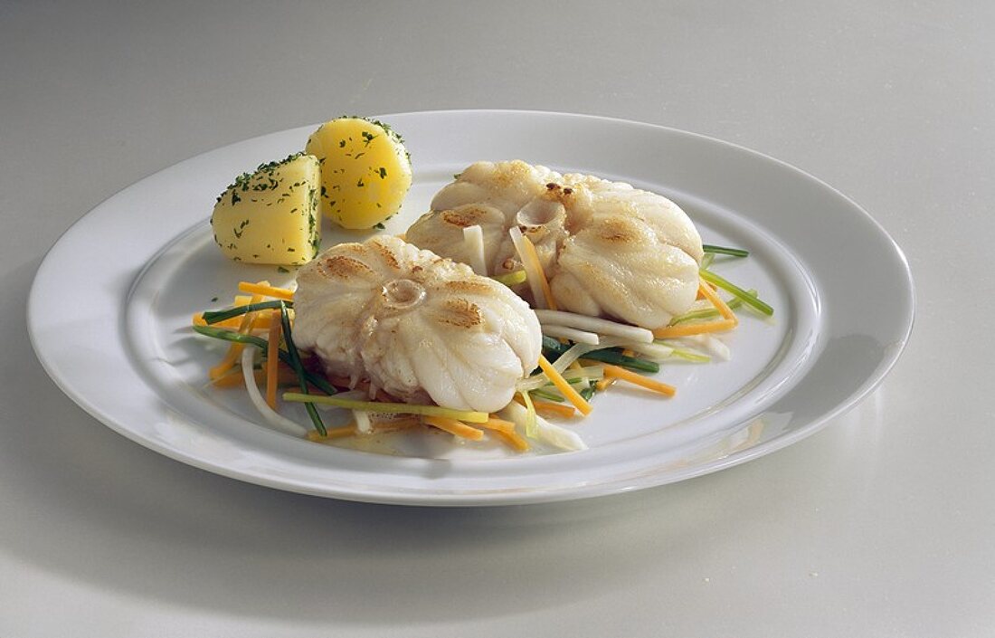 Monkfish on julienne vegetables with parsley potatoes
