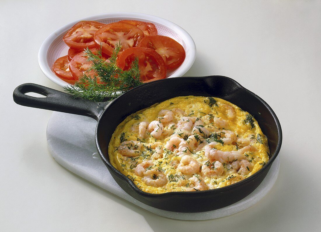 Scrambled egg with shrimps and tomato salad