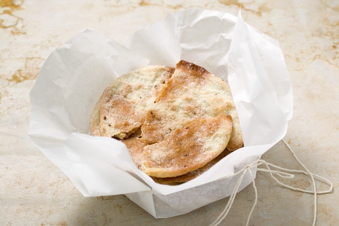Caramelised aniseed biscuits in paper (Spain)