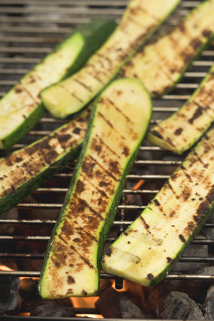 Slices of courgette on a barbecue