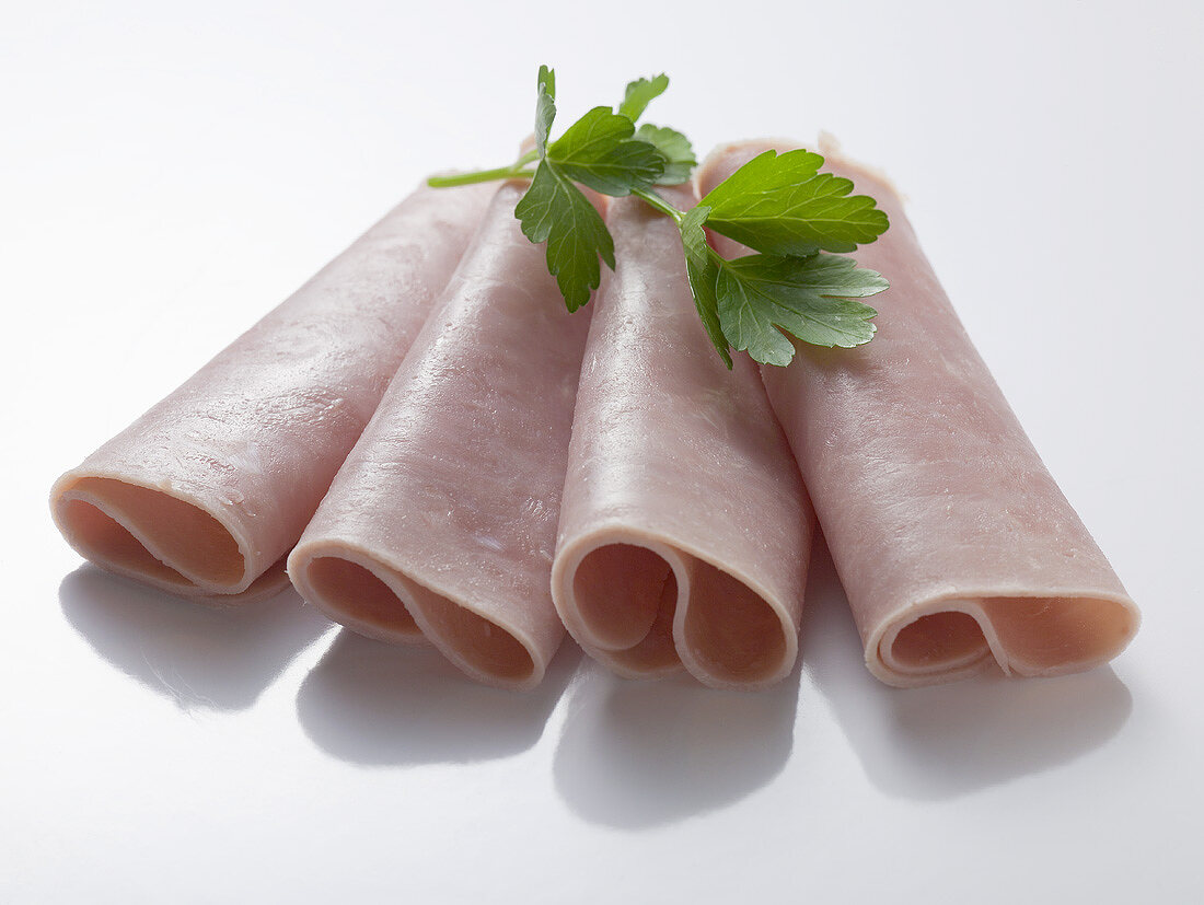 Ham rolls garnished with parsley