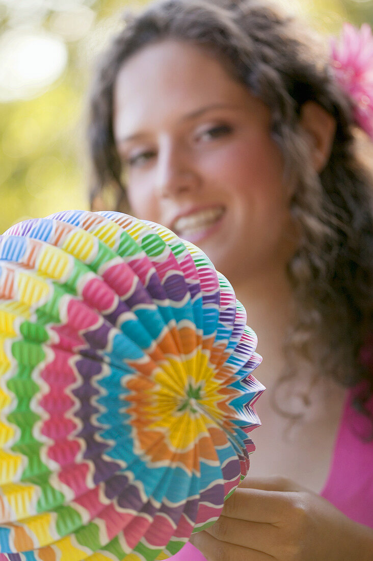 Woman holding coloured Chinese lantern