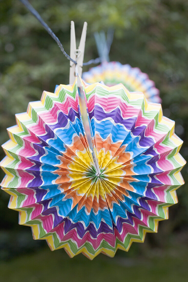 Coloured Chinese lanterns on washing line (garden party decorations)