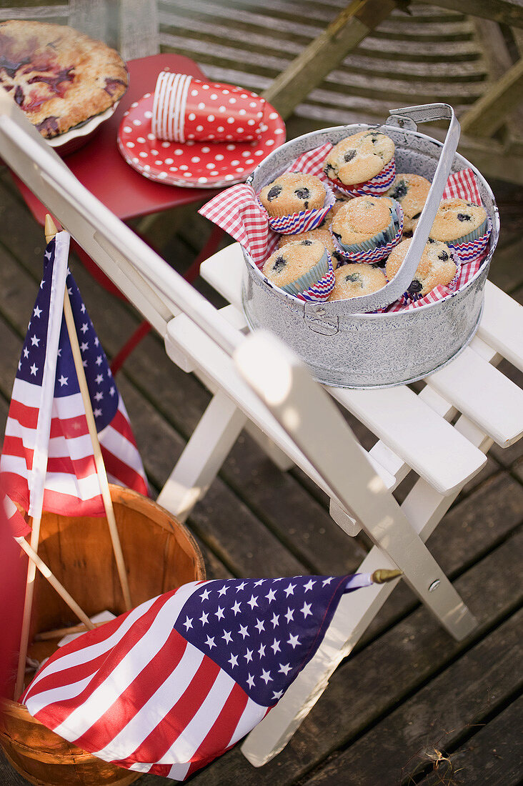 Blueberry muffins on a garden chair, 4th of July (USA)