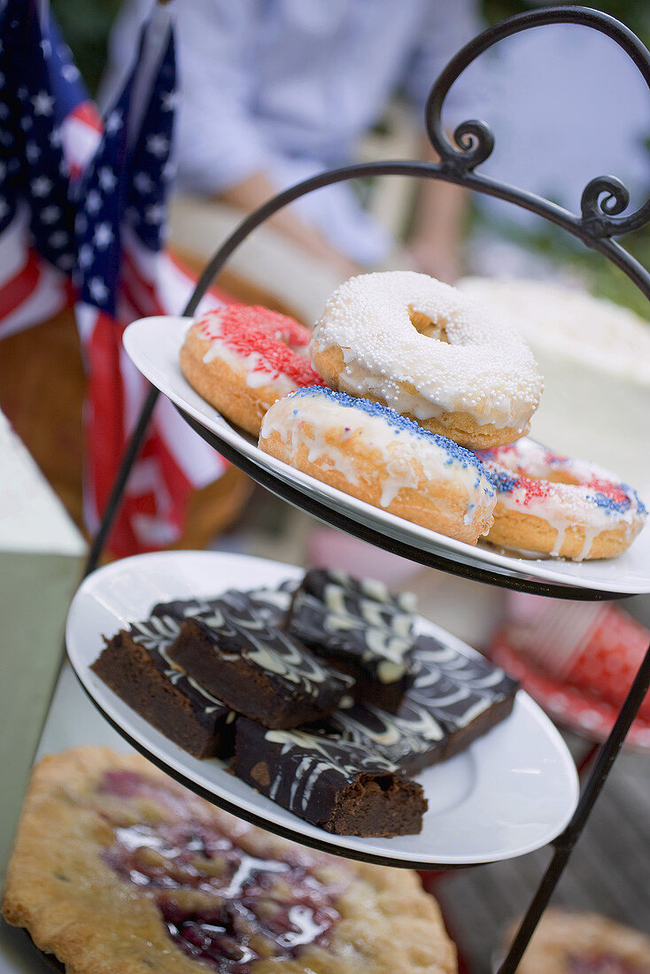 Doughnuts, brownies & pie on tiered stand (4th of July, USA)