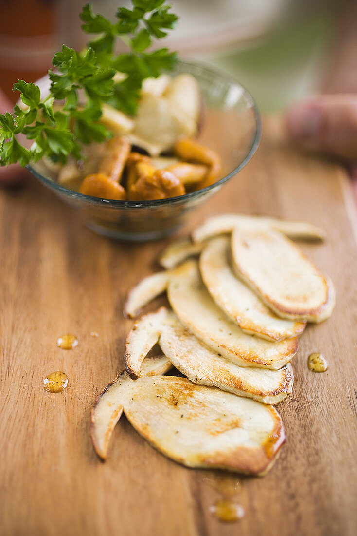 Fried cep slices, chanterelles and parsley