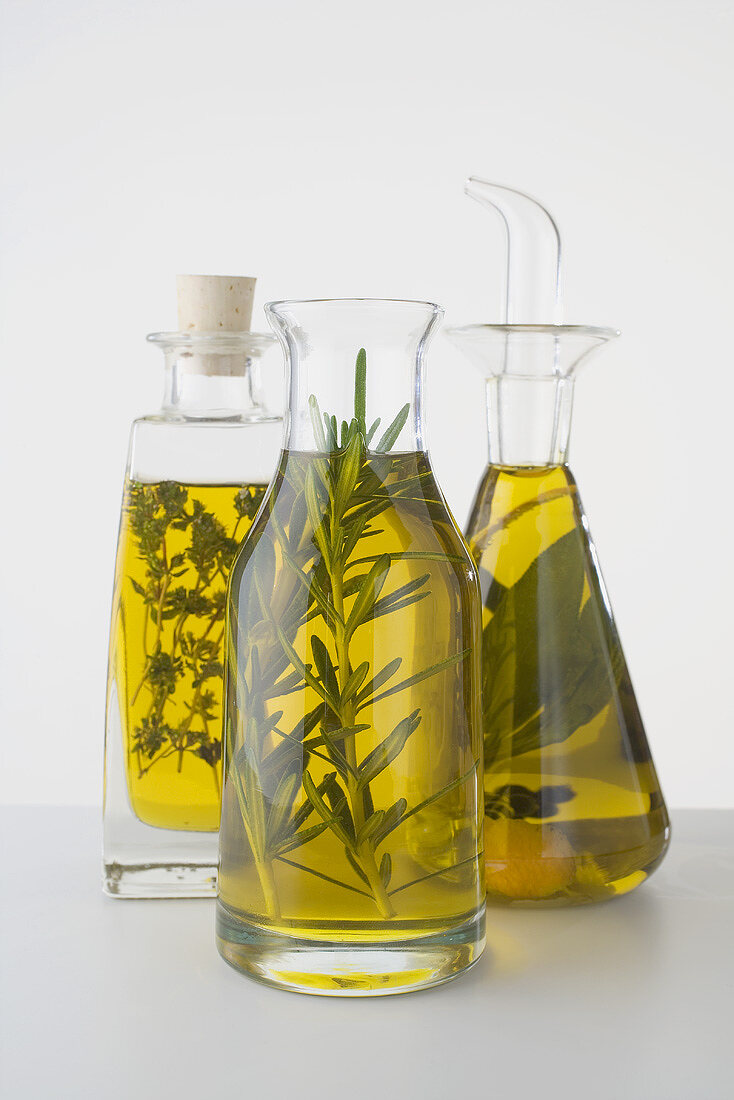 Three different herb oils in bottles