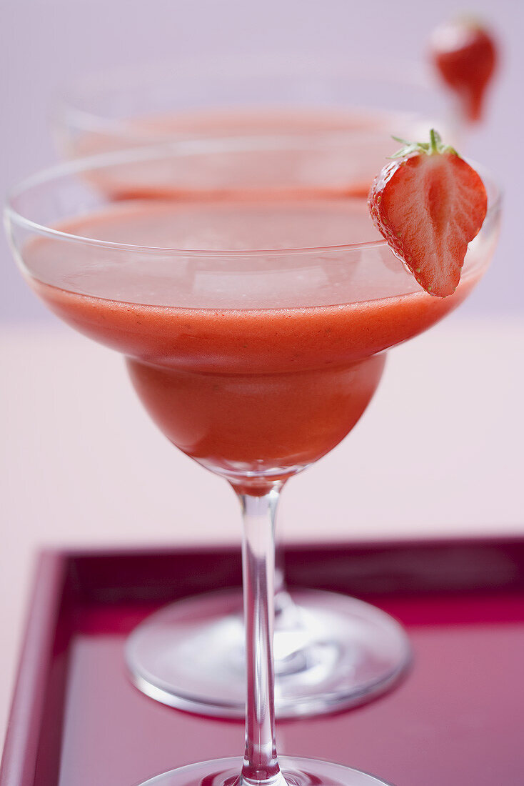 Two glasses of Strawberry Daiquiri on tray