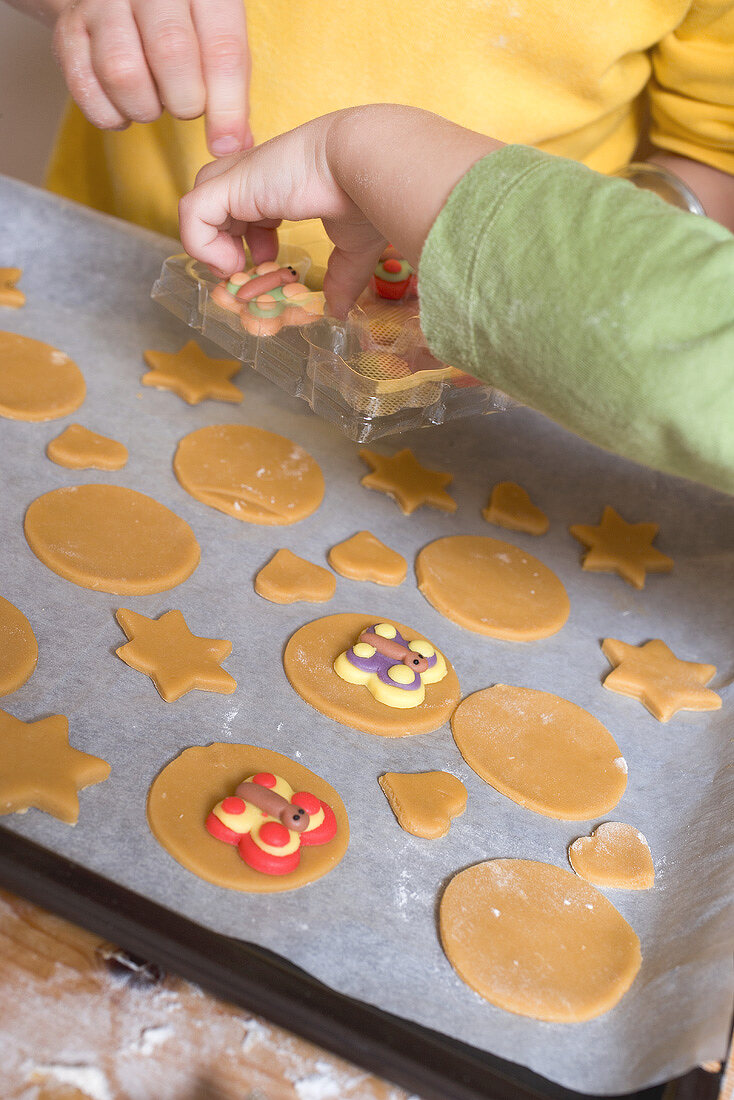 Children decorating biscuits