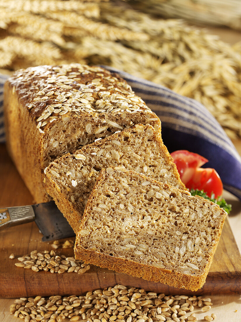 Oatmeal bread with sunflower seeds, partly sliced