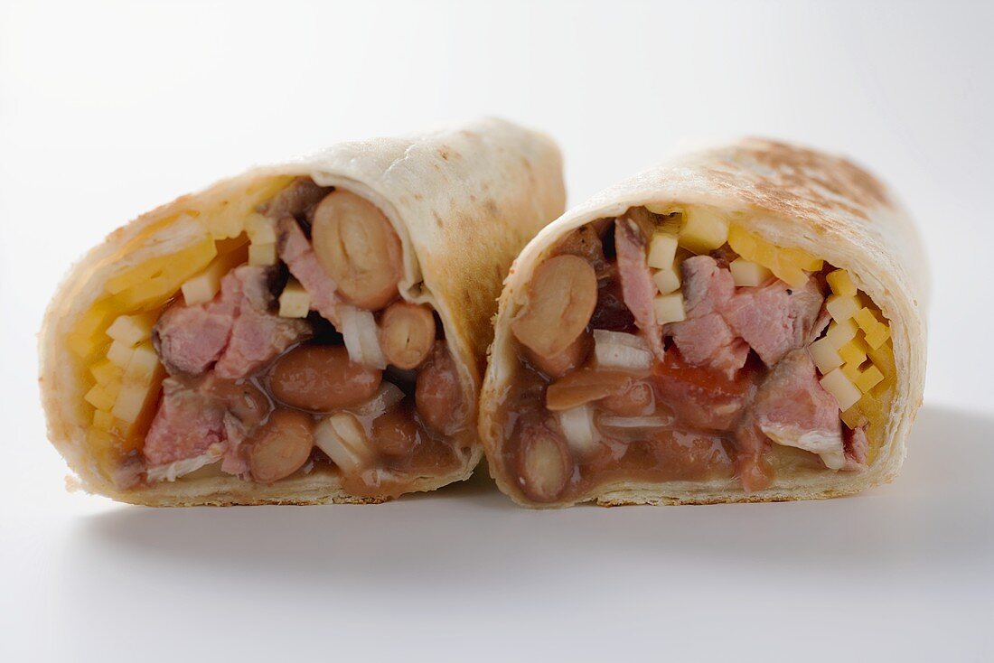Two wraps filled with meat, beans, cheese and onion
