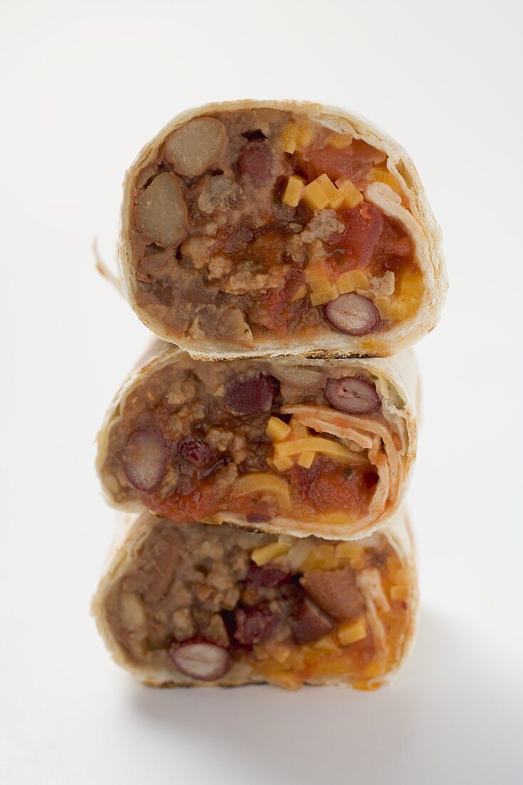 Three wraps filled with mince, beans and cheese (stacked)