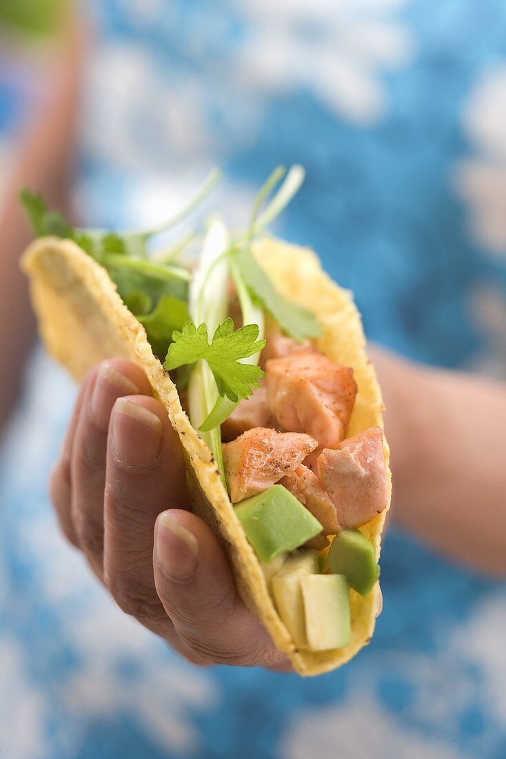 Woman holding taco