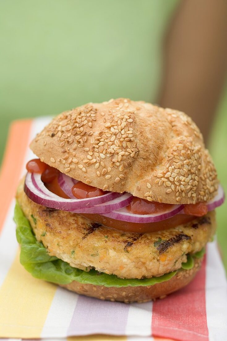 Woman holding grilled vegetable burger
