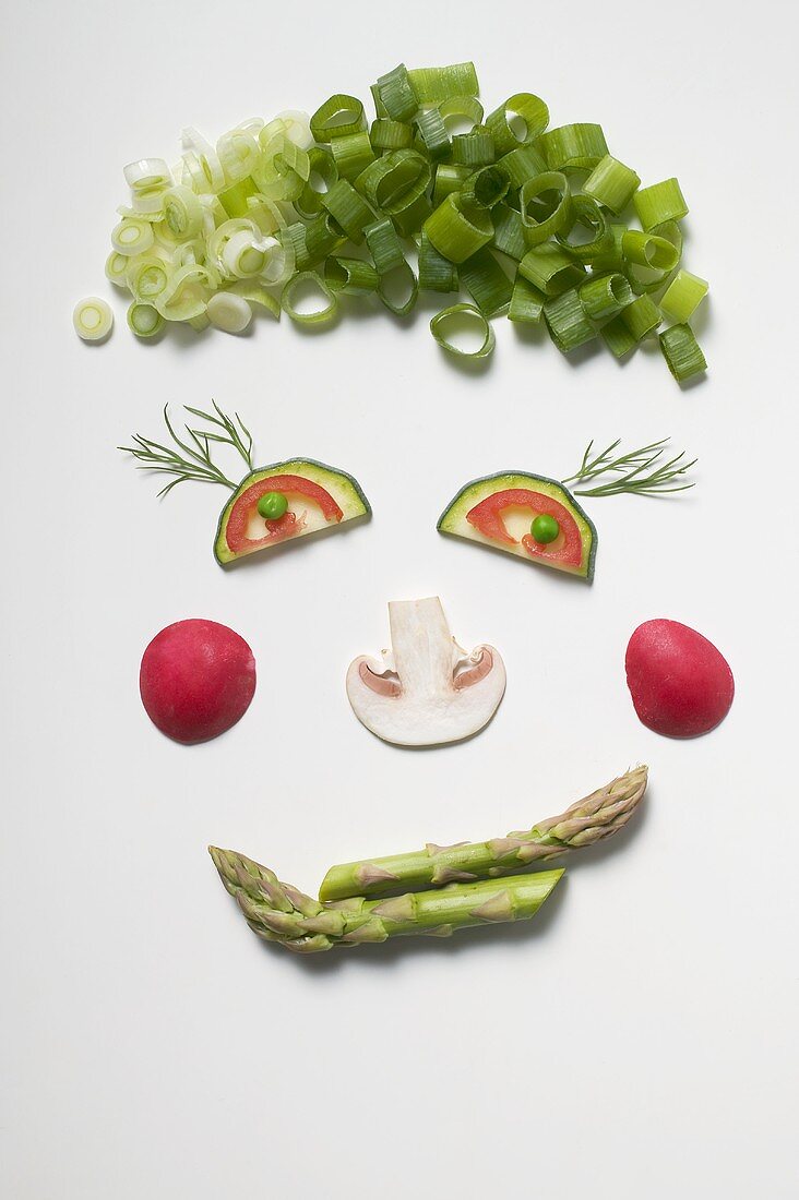 Amusing face made from vegetables, dill and mushroom